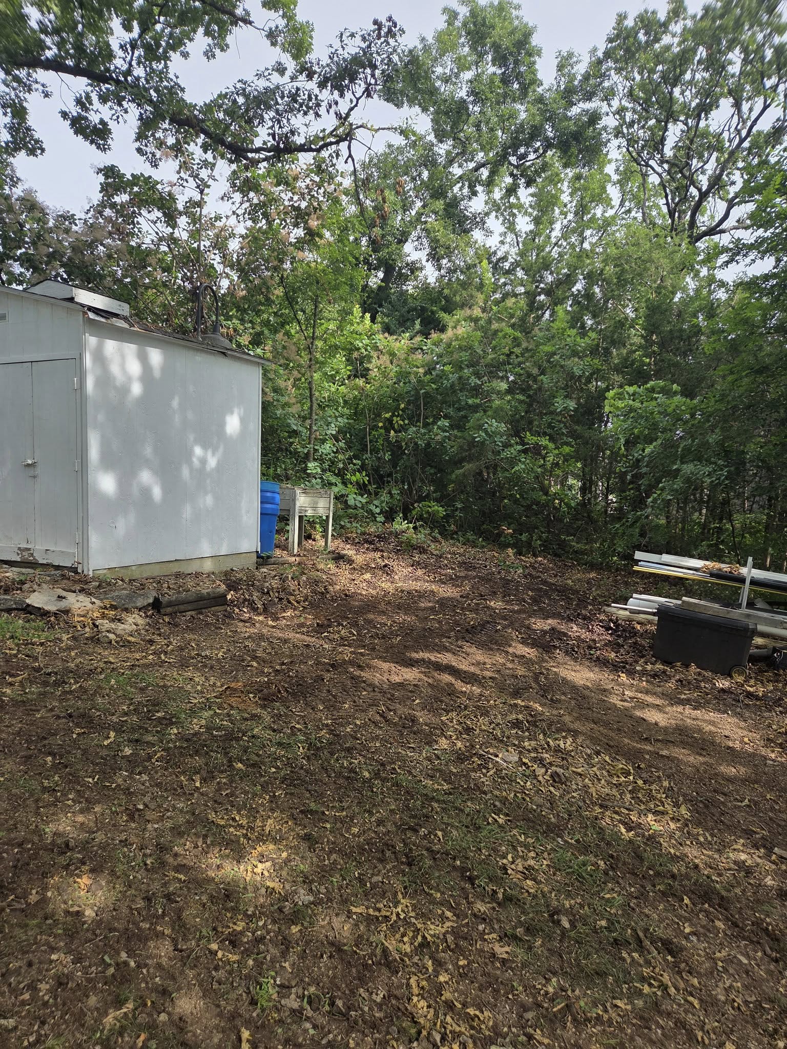 a pad cleared for a shop building construction project